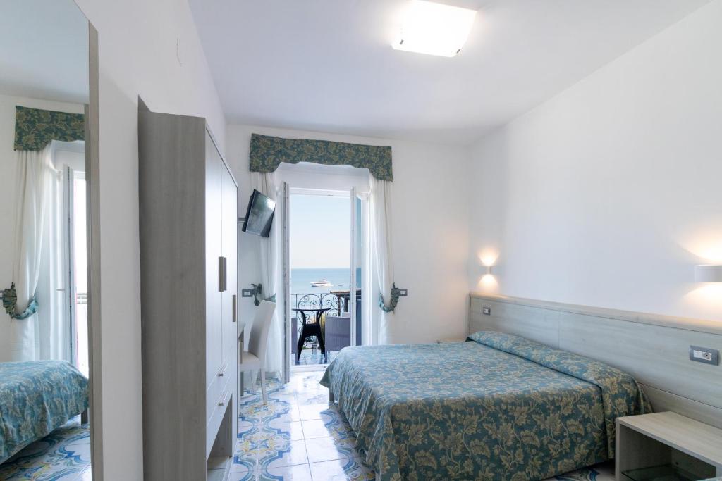 Postel nebo postele na pokoji v ubytování Hotel Da Maria