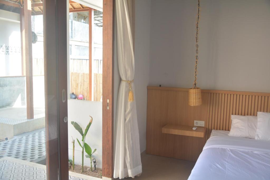 Postel nebo postele na pokoji v ubytování THe Kind Homestay