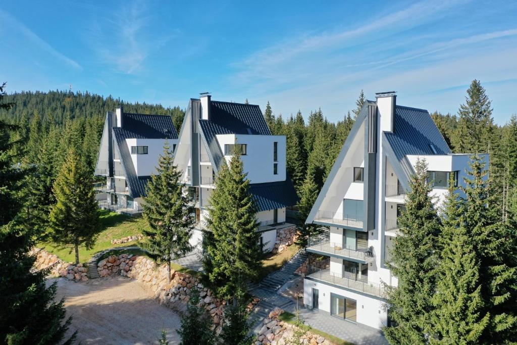 an aerial view of a house in the woods at GO Jahorina by Olympic Gardens in Jahorina
