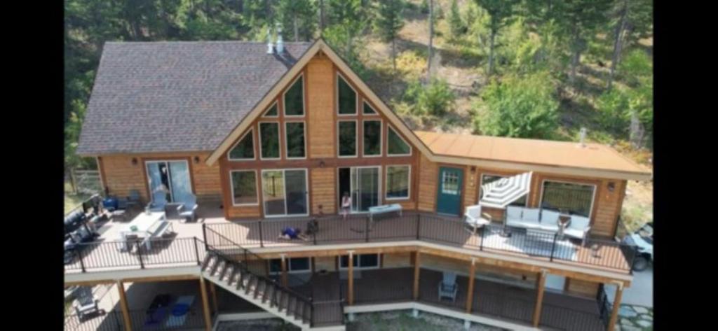 an aerial view of a large wooden house at Ponderosa Glen @ Ashley Lake in Kila