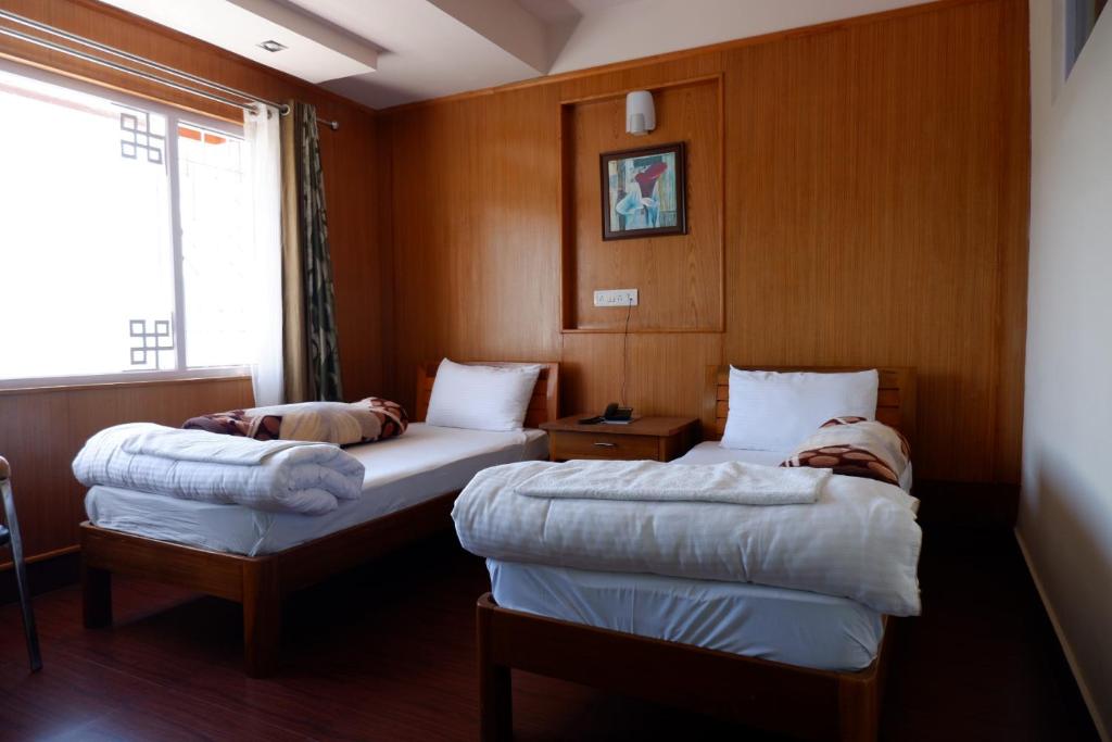Una cama o camas en una habitación de Hotel Mon Paradise