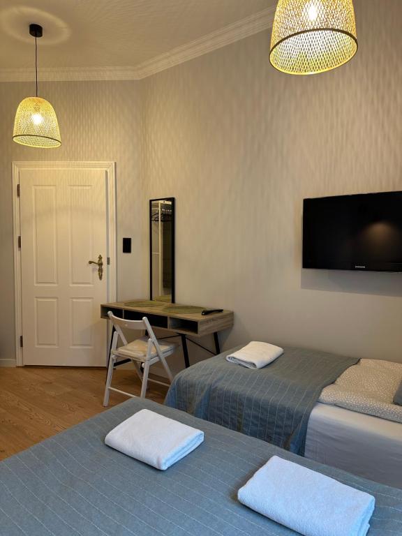 Postel nebo postele na pokoji v ubytování Kamienica Ogrodowa Rooms