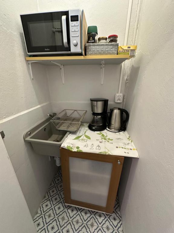 Kuchyň nebo kuchyňský kout v ubytování Kamienica Ogrodowa Rooms
