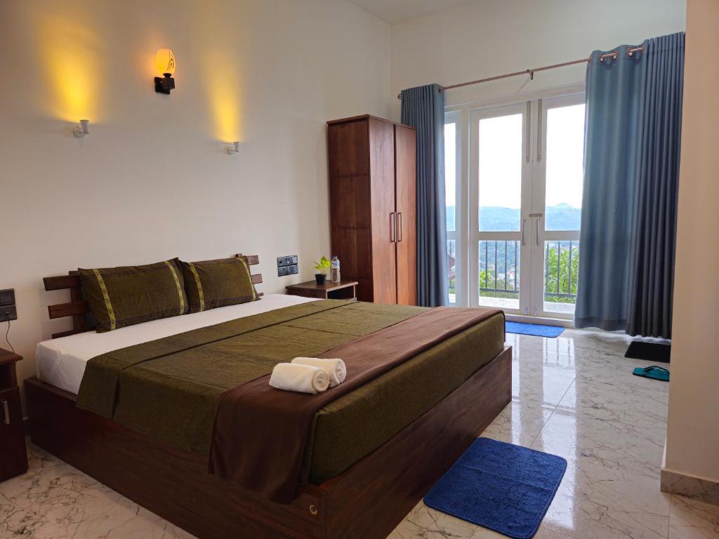Postel nebo postele na pokoji v ubytování Golden sky Residence