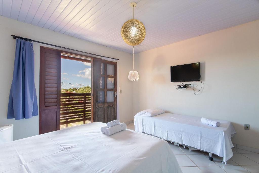 Postel nebo postele na pokoji v ubytování Pousada Villa Martins