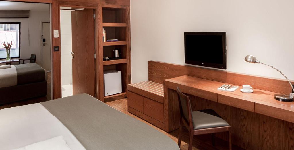 TV a/nebo společenská místnost v ubytování Eko Hotel Gardens