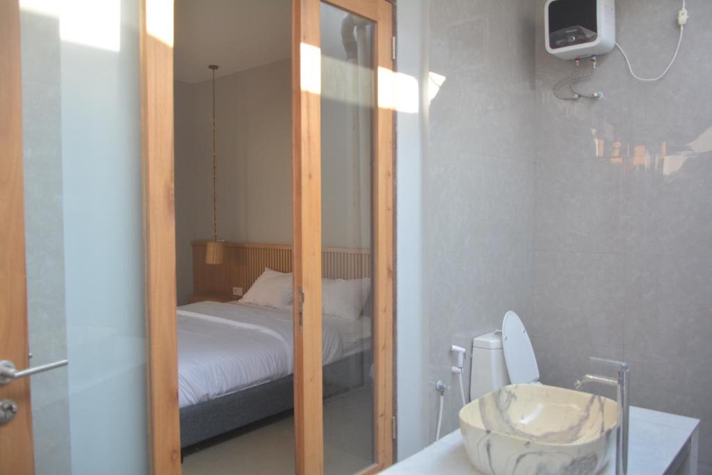 Postel nebo postele na pokoji v ubytování THe Kind Homestay
