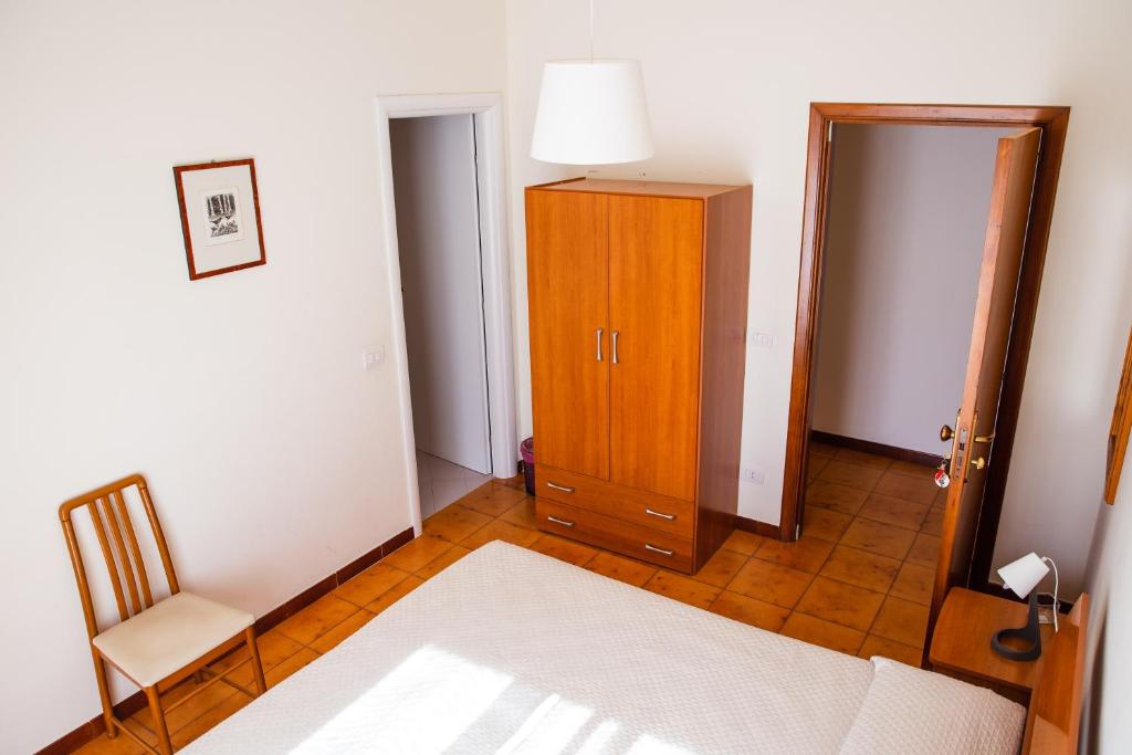 Postel nebo postele na pokoji v ubytování B&B Ulisse