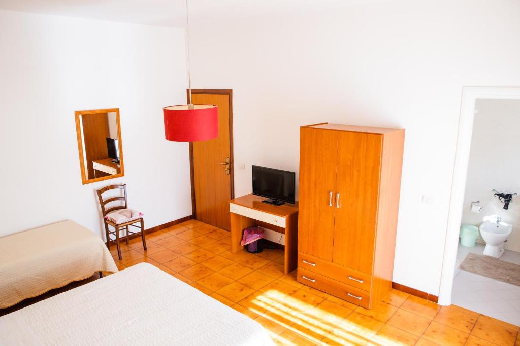 Postel nebo postele na pokoji v ubytování B&B Ulisse