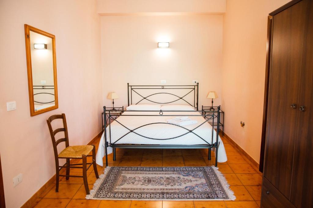 Postel nebo postele na pokoji v ubytování B&B Ulisse