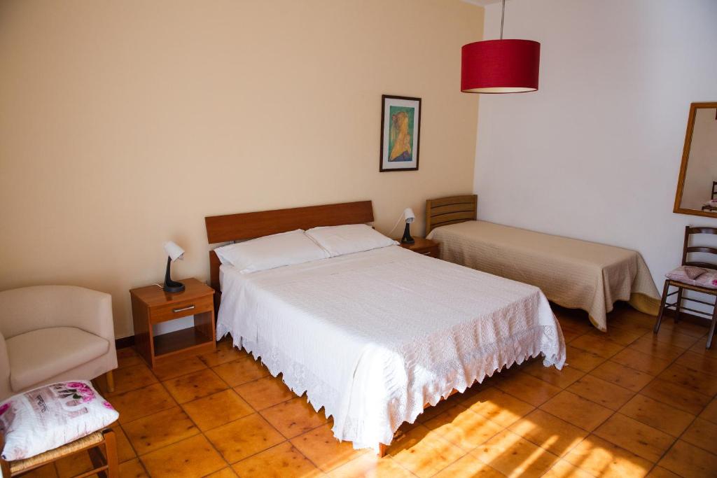 Postel nebo postele na pokoji v ubytování B&B Ulisse