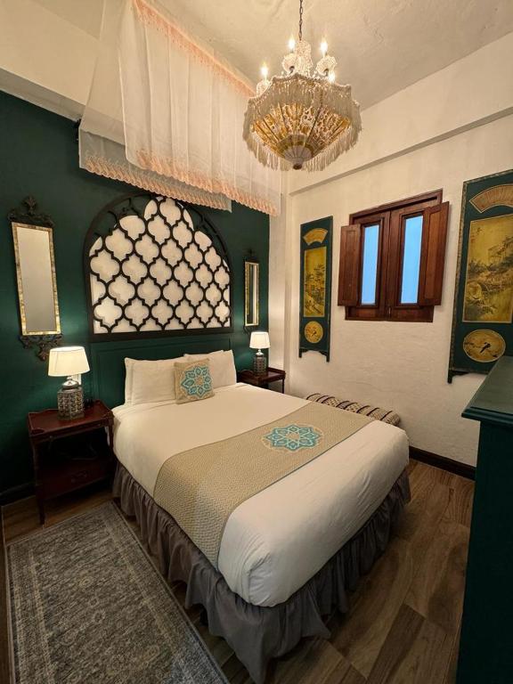 Postel nebo postele na pokoji v ubytování CasaBlanca Hotel