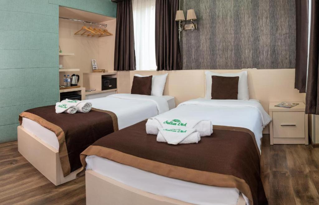 Postel nebo postele na pokoji v ubytování Sultan Hotel Tbilisi