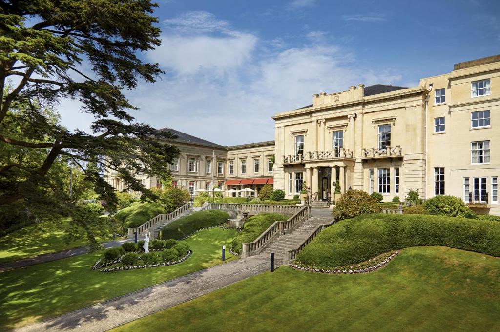 a large building with a garden in front of it at Macdonald Bath Spa Hotel in Bath