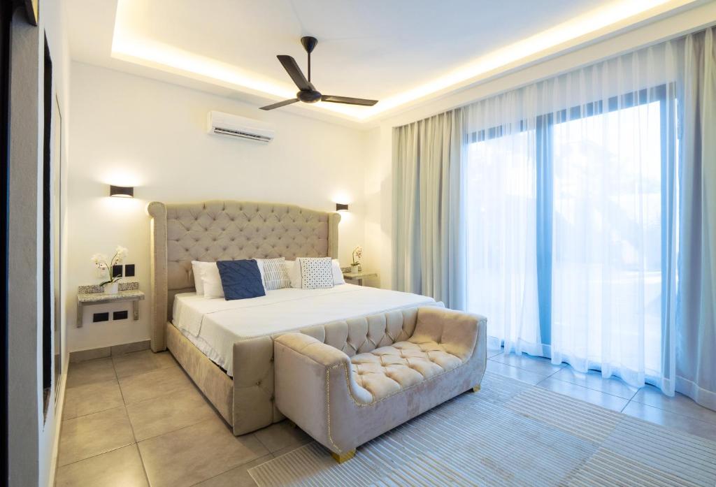 Postel nebo postele na pokoji v ubytování Instyle Residences at RIZZ SUITES