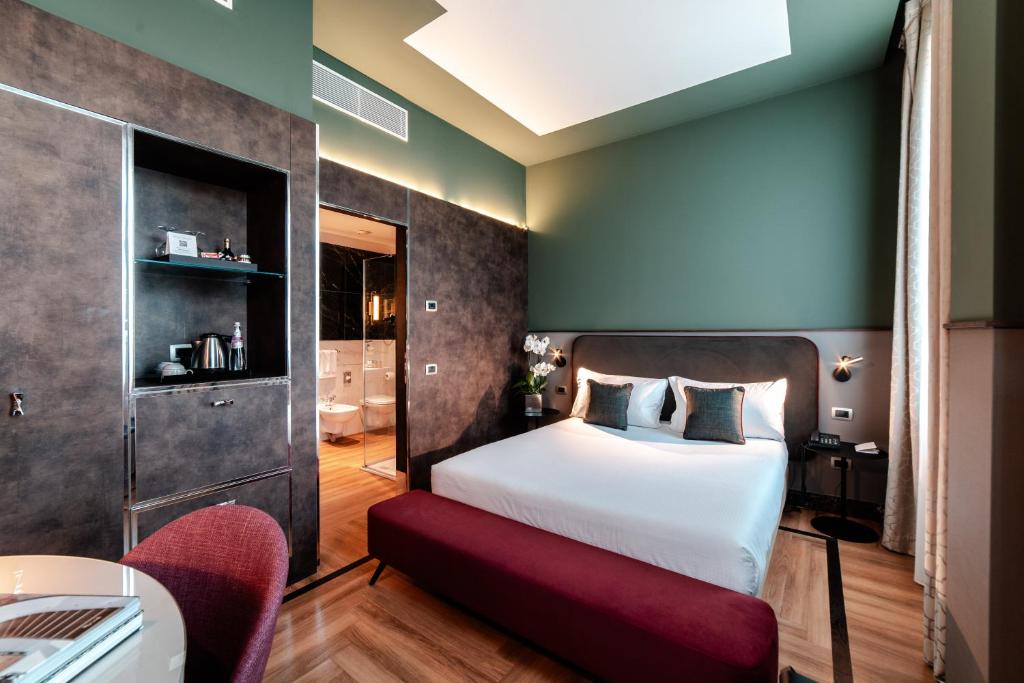Postel nebo postele na pokoji v ubytování Bianca Maria Palace Hotel