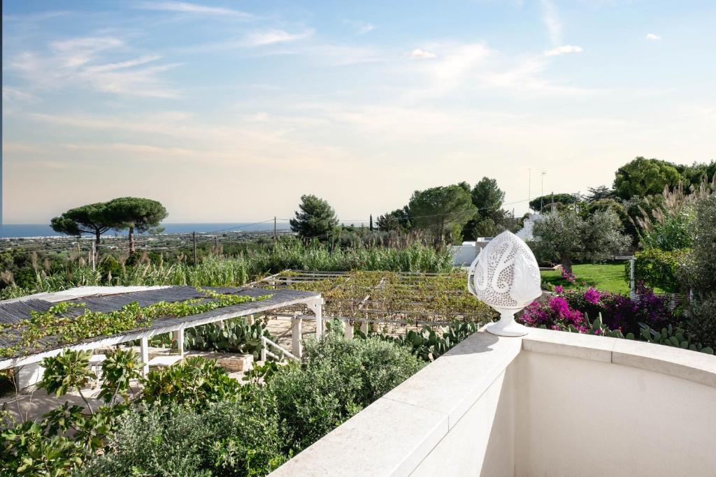 a view of a garden from the roof of a house at San Lorenzo Boutique Hotel & SPA in Polignano a Mare