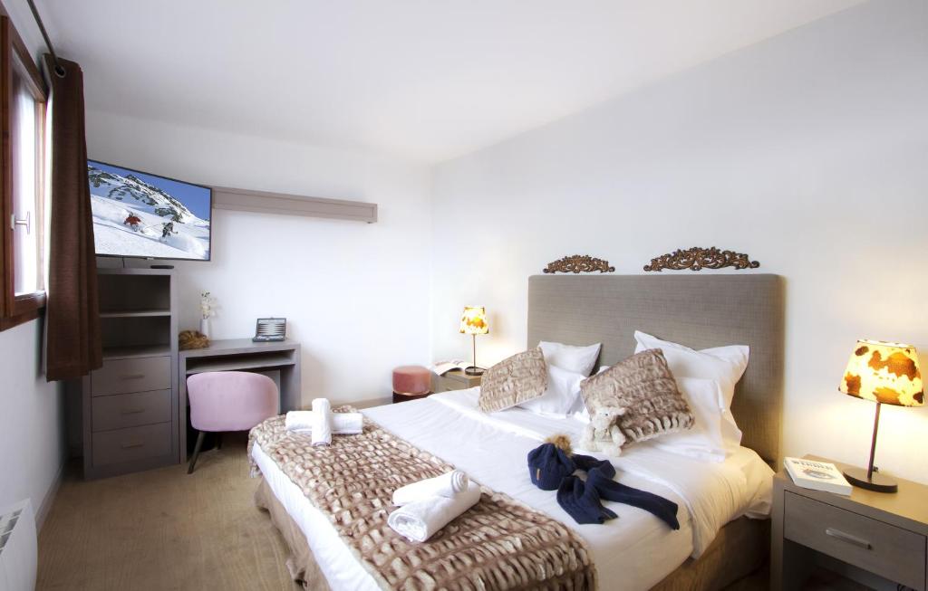 Postel nebo postele na pokoji v ubytování Odalys Hotel New Solarium