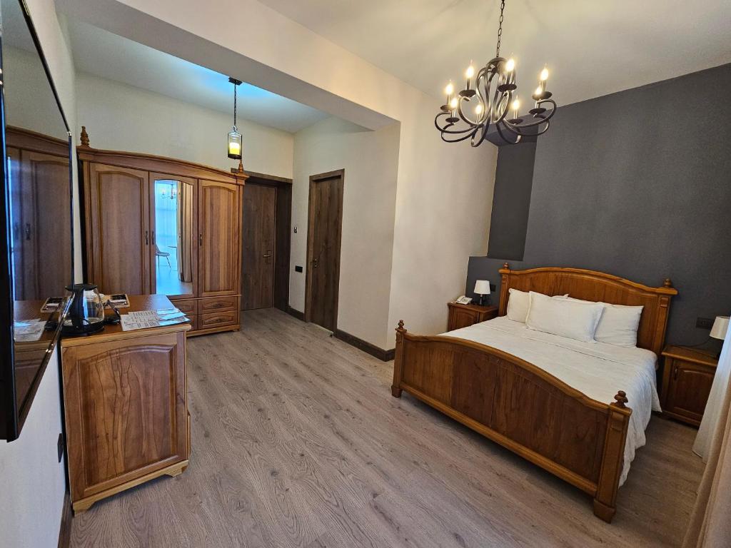 Postel nebo postele na pokoji v ubytování Old Avenue Hotel