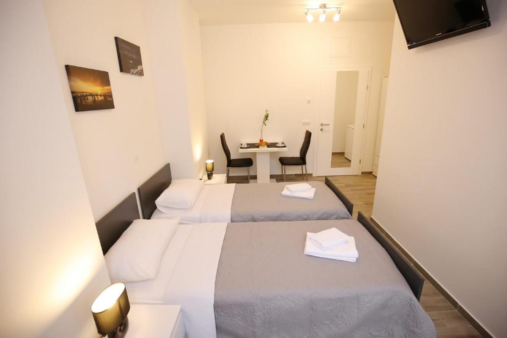 Letto o letti in una camera di Sites Of Zadar Rooms