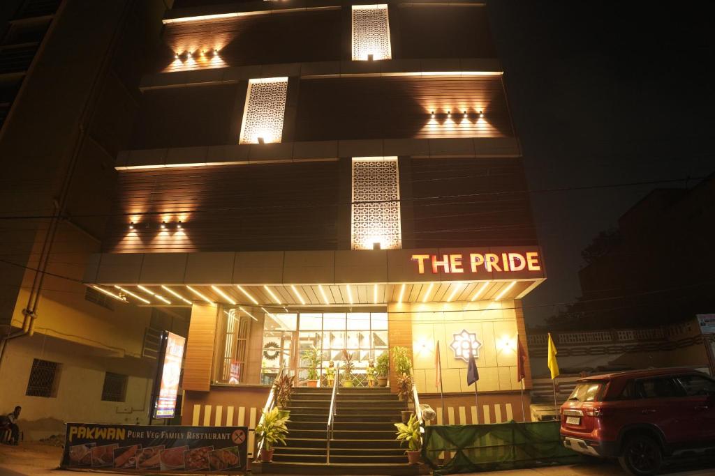 a building with a sign that reads the pride at The Pride in Jamshedpur