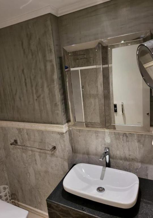 Koupelna v ubytování Hayat Apartments