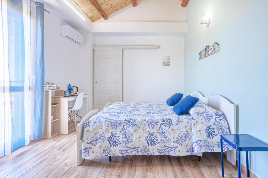 Postel nebo postele na pokoji v ubytování LANTERNA DEL DELTA Guest House
