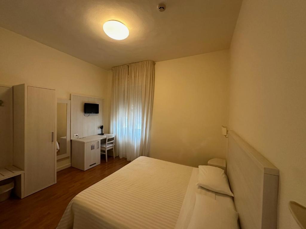 Postel nebo postele na pokoji v ubytování Hotel La Pace