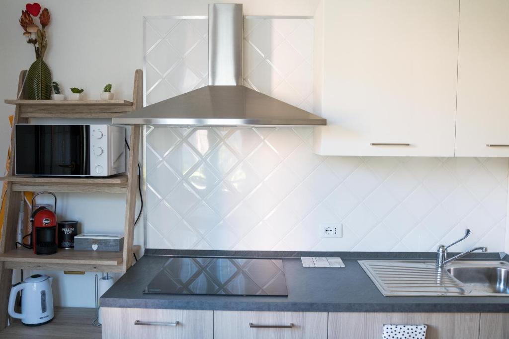 Kuchyň nebo kuchyňský kout v ubytování All’Altana b&b apartment