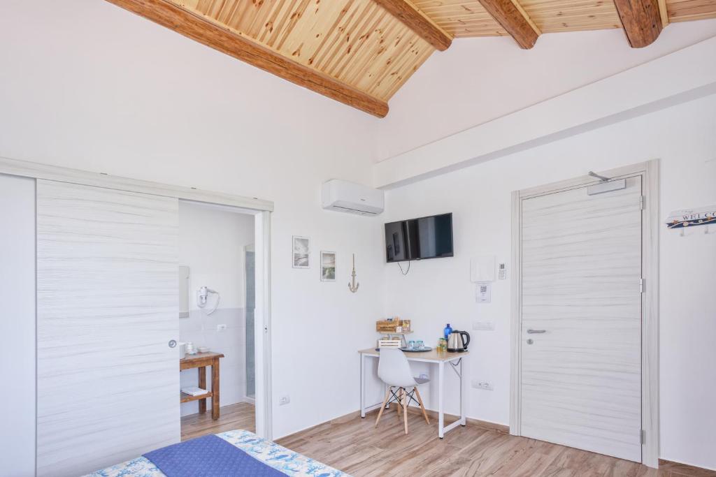 TV a/nebo společenská místnost v ubytování LANTERNA DEL DELTA Guest House