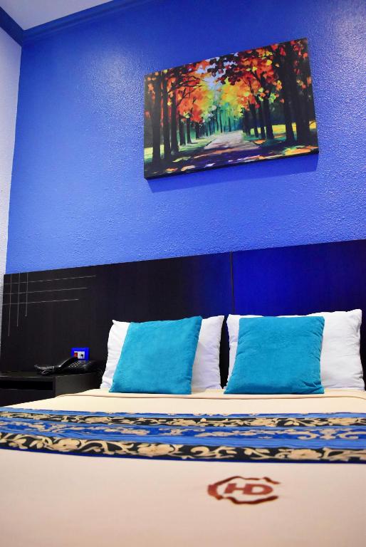 Postel nebo postele na pokoji v ubytování Hotel Del Centro
