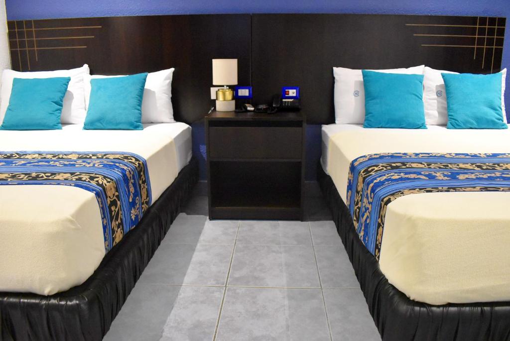 Postel nebo postele na pokoji v ubytování Hotel Del Centro