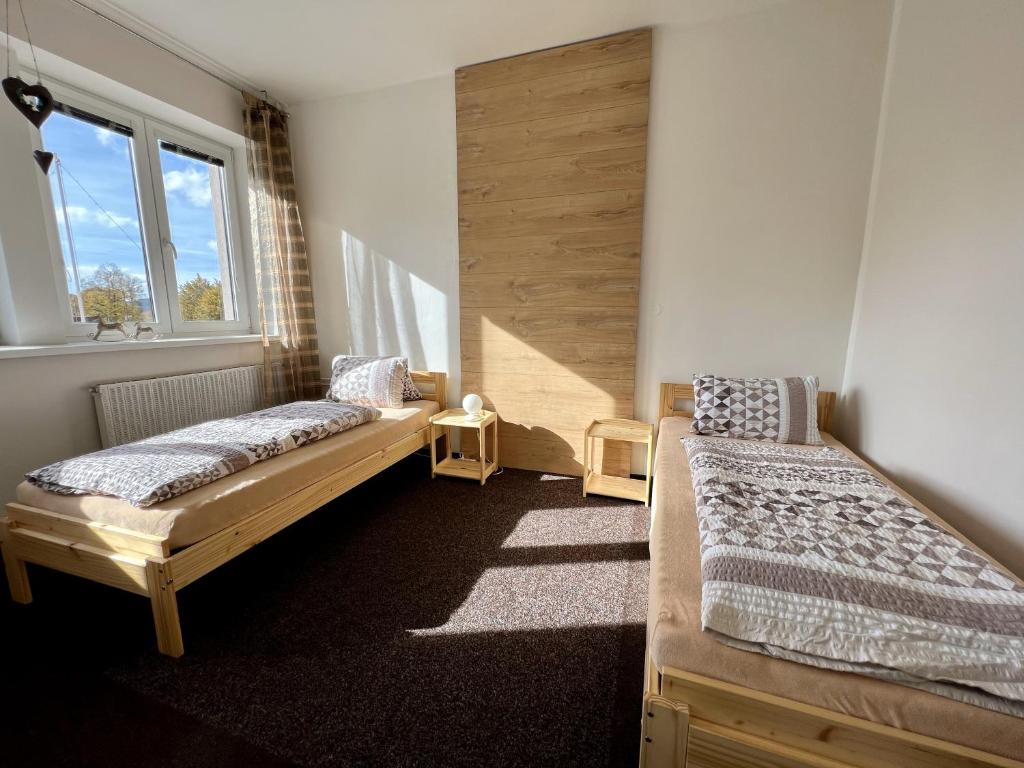Postel nebo postele na pokoji v ubytování Pension Fortuna