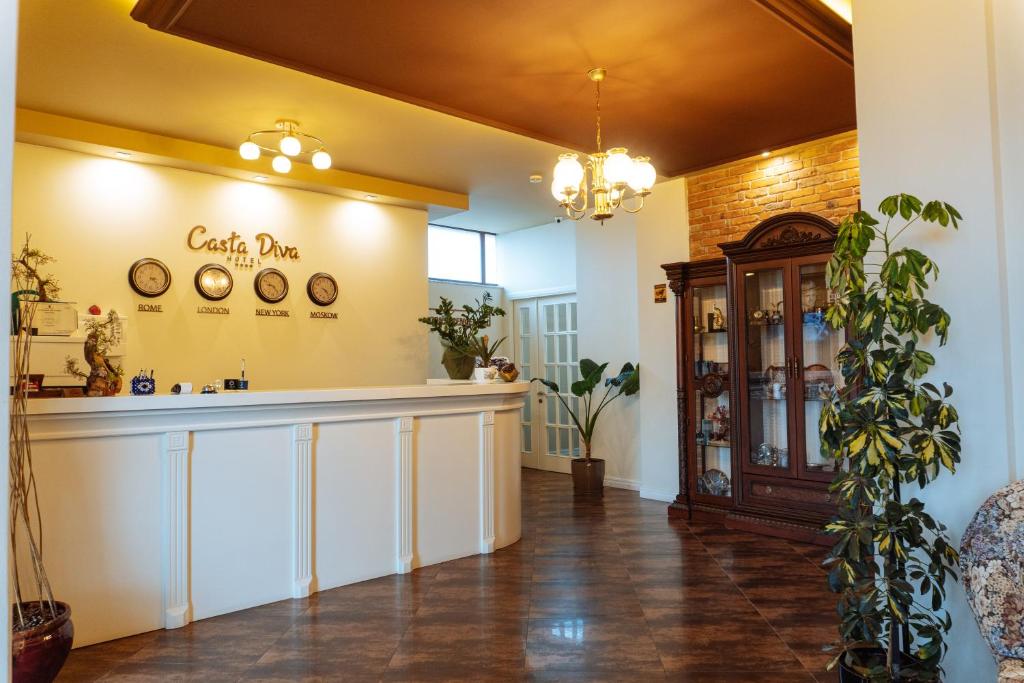 a salon with a counter in a room with a pharmacy at Casta Diva Boutique Hotel in Korçë