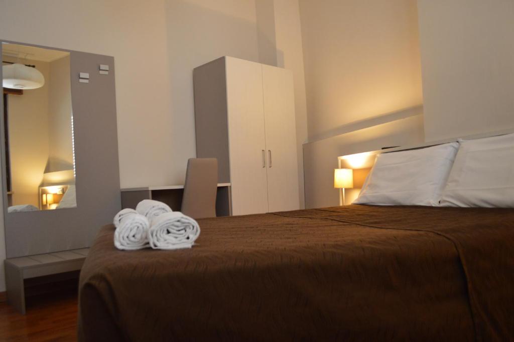 Postel nebo postele na pokoji v ubytování Hotel Arena