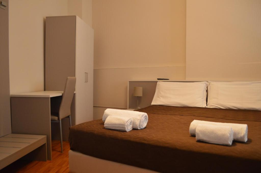 Postel nebo postele na pokoji v ubytování Hotel Arena