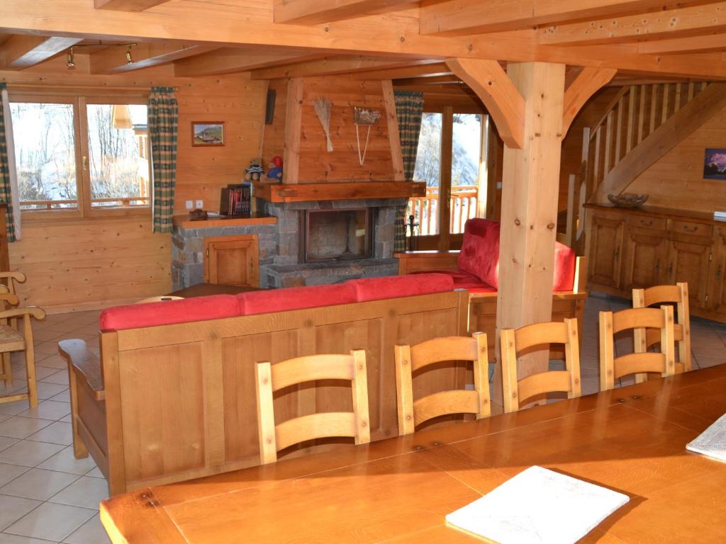 a dining room with a bar in a cabin at Chalet Le Grand-Bornand, 7 pièces, 14 personnes - FR-1-467-64 in Le Grand-Bornand