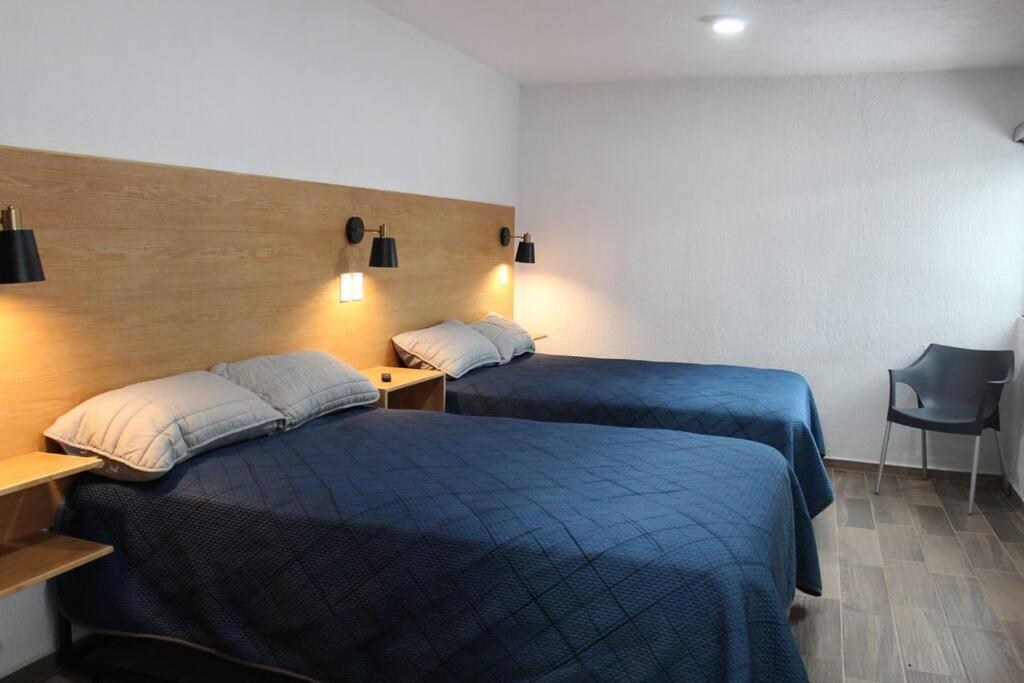En eller flere senge i et værelse på Departamento amueblado en Zapopan cerca de Expo gdl, ITESO y UVM