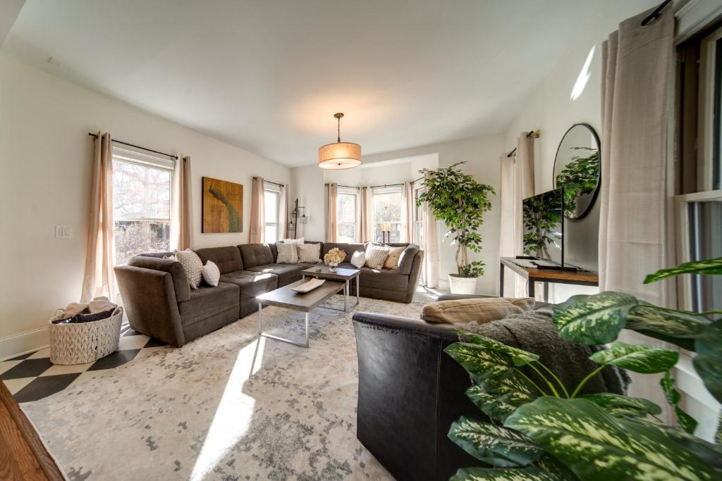 a living room with a couch and a table at Peninsula Paradise - Walk to Hiking and Shopping! in Peninsula