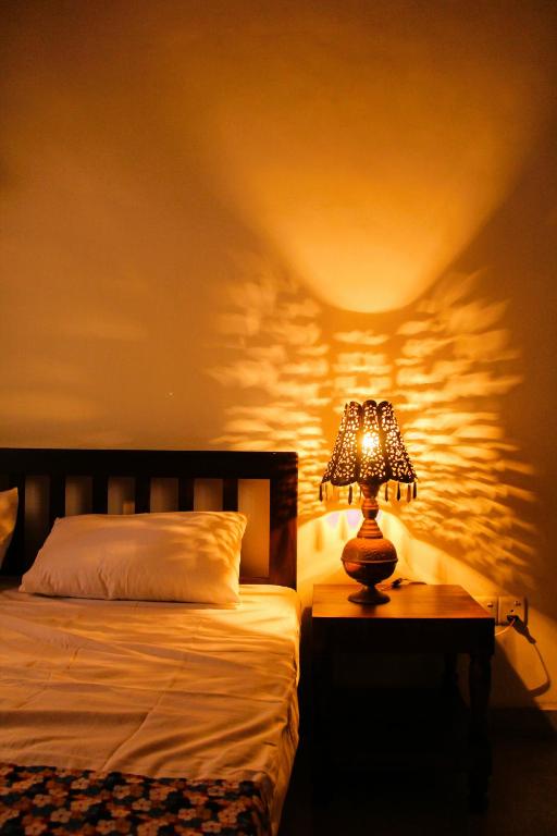 Postel nebo postele na pokoji v ubytování Muduna Walawwa Resort