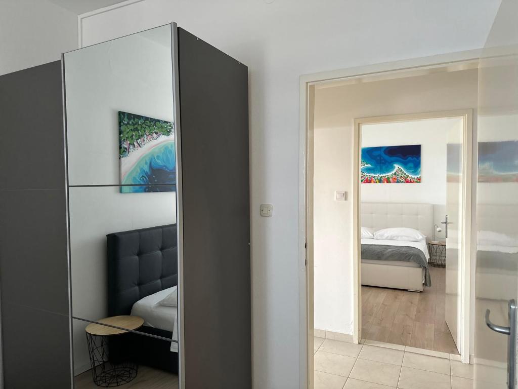 Łóżko lub łóżka w pokoju w obiekcie Apartments Gita