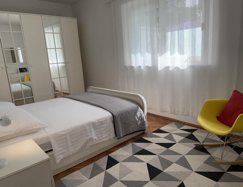 Łóżko lub łóżka w pokoju w obiekcie Apartments Gita