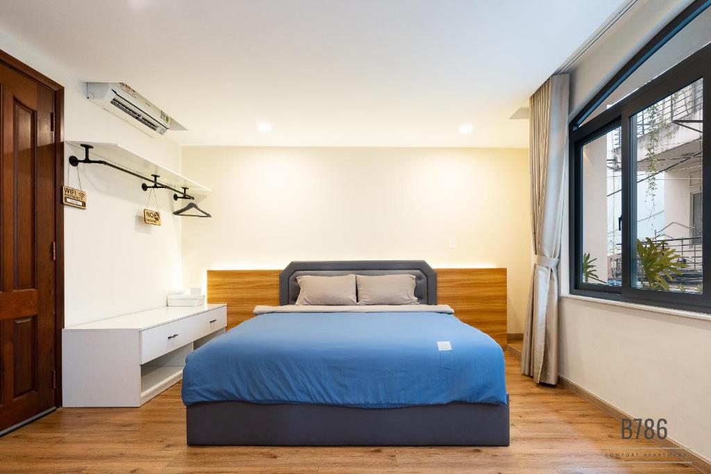 Postel nebo postele na pokoji v ubytování B786 Airport Apartment
