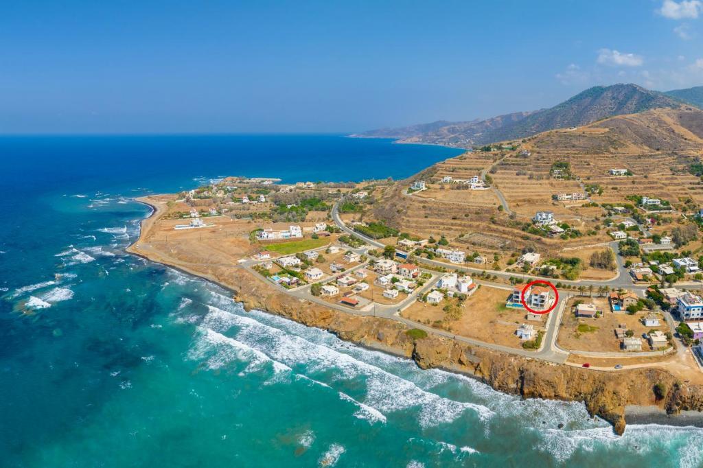 an aerial view of a small island in the ocean at Villa Serena in Pomos