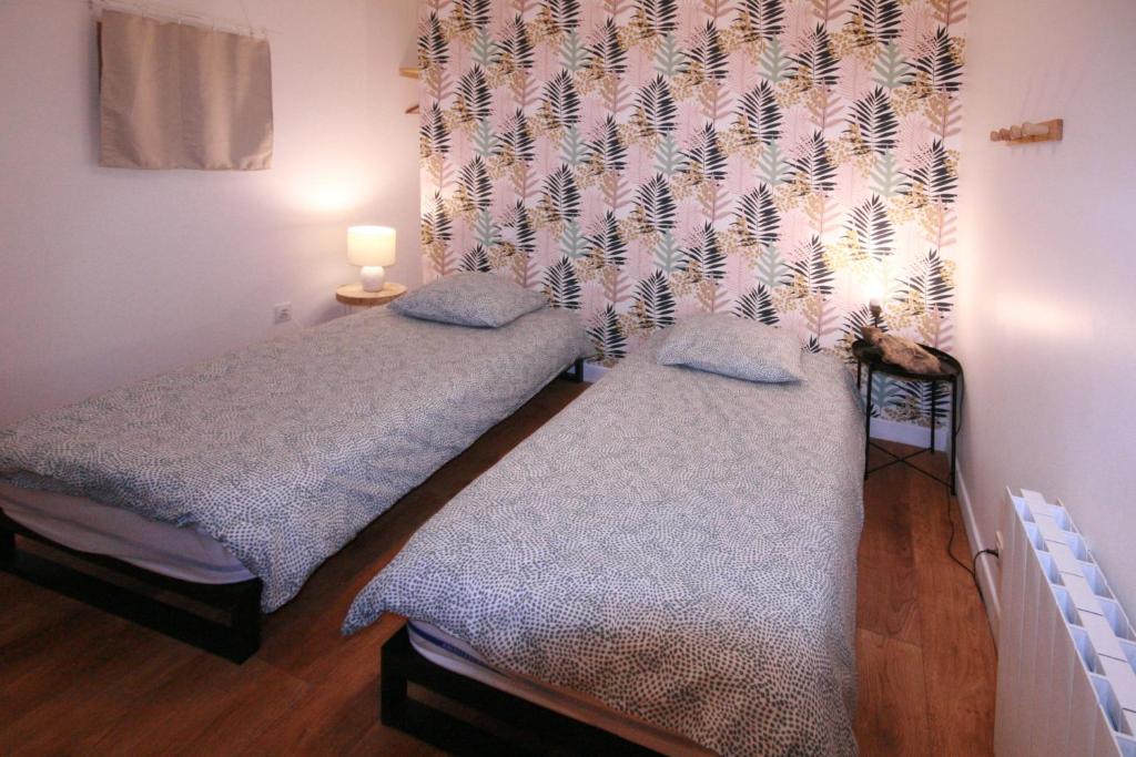 Posteľ alebo postele v izbe v ubytovaní Les appartements de Clélia
