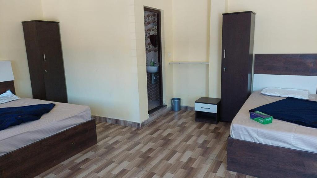 Postel nebo postele na pokoji v ubytování Jeru Homes