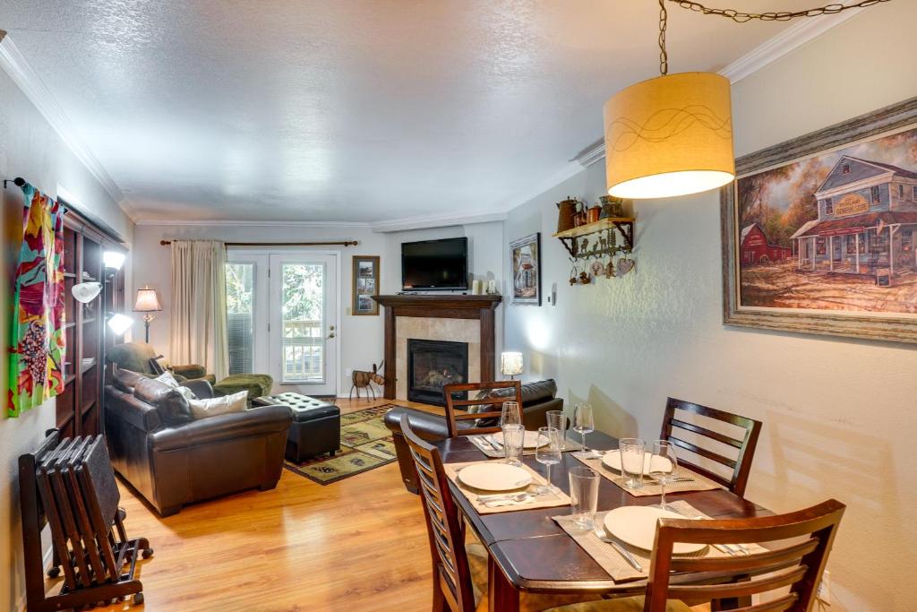 a dining room and living room with a table and chairs at Cozy Condo with Fireplace - Near Brian Head Resort! in Brian Head