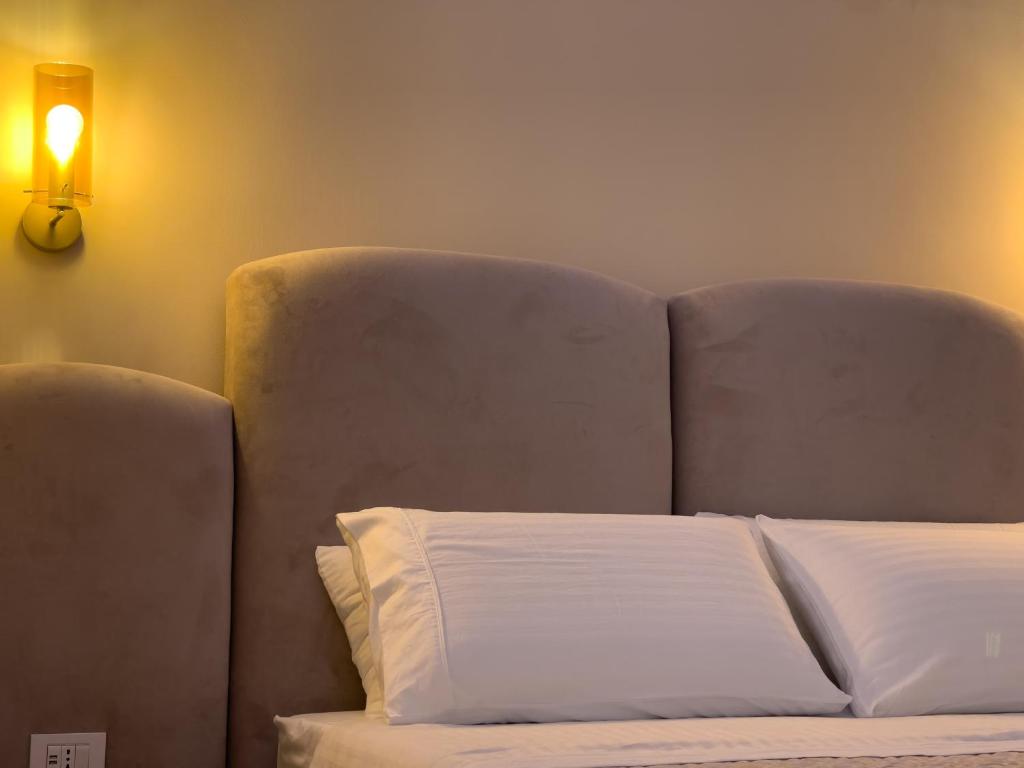 Postel nebo postele na pokoji v ubytování Ritucci Suite