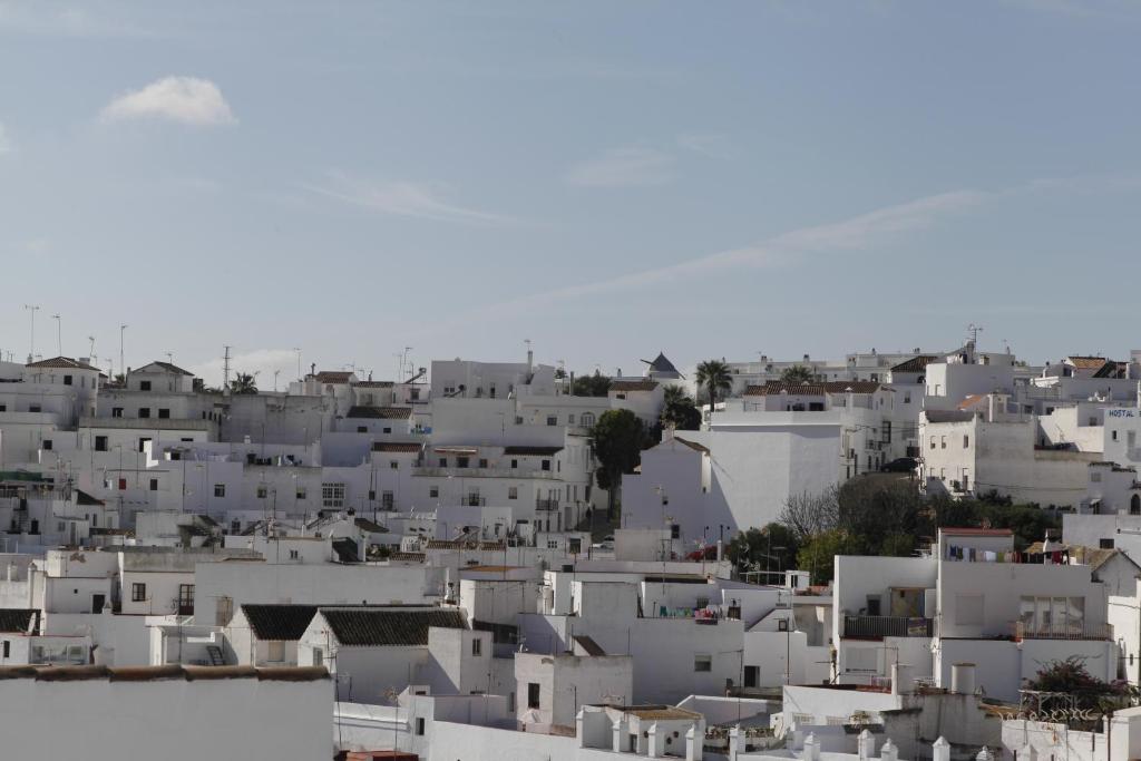 a view of a city with white buildings at Apartamentos Casamonteymar Bas-Ser in Vejer de la Frontera