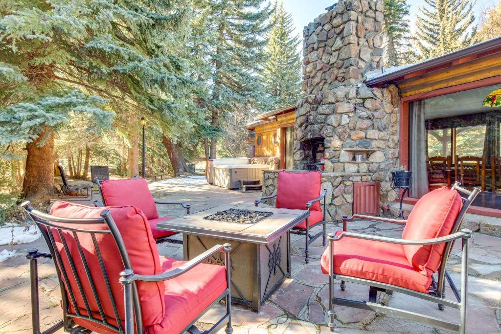 a group of chairs and a table on a patio at Charming Idaho Springs Retreat on Chicago Creek! in Idaho Springs